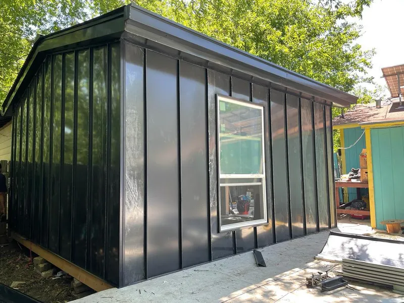 Black standing seam metal wall panels for Roof Inspection in Seward