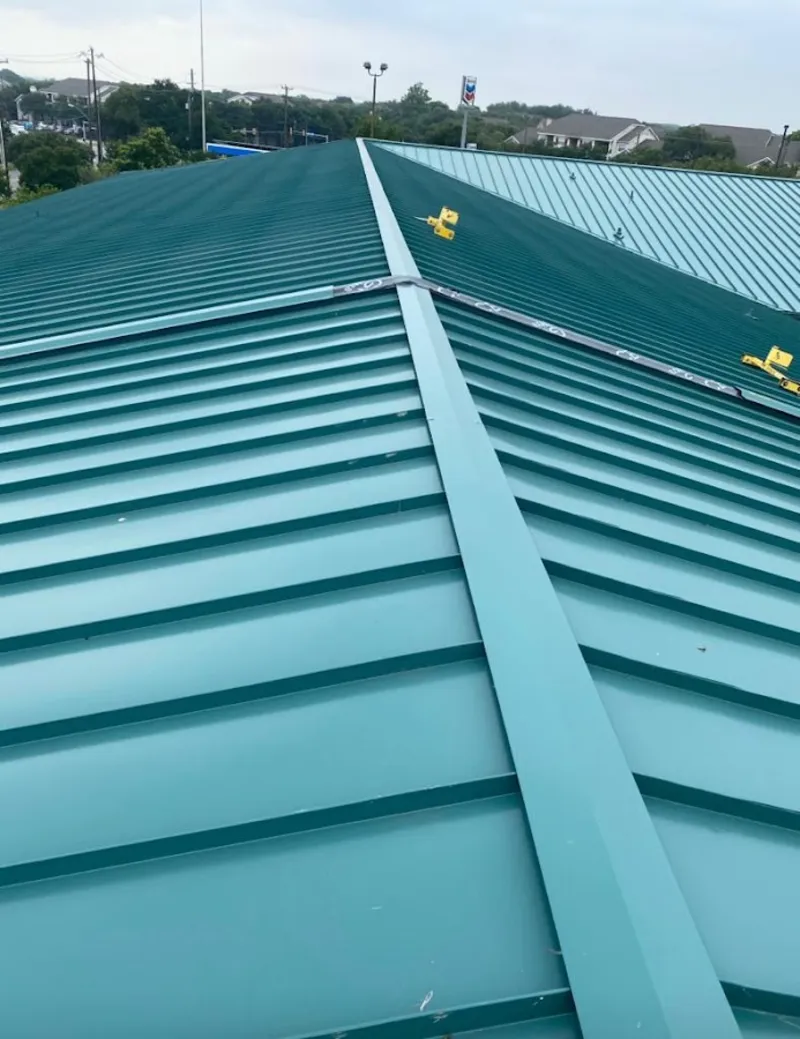 Green commercial metal roof ridge and valley for Metal Roof Repair in Seward